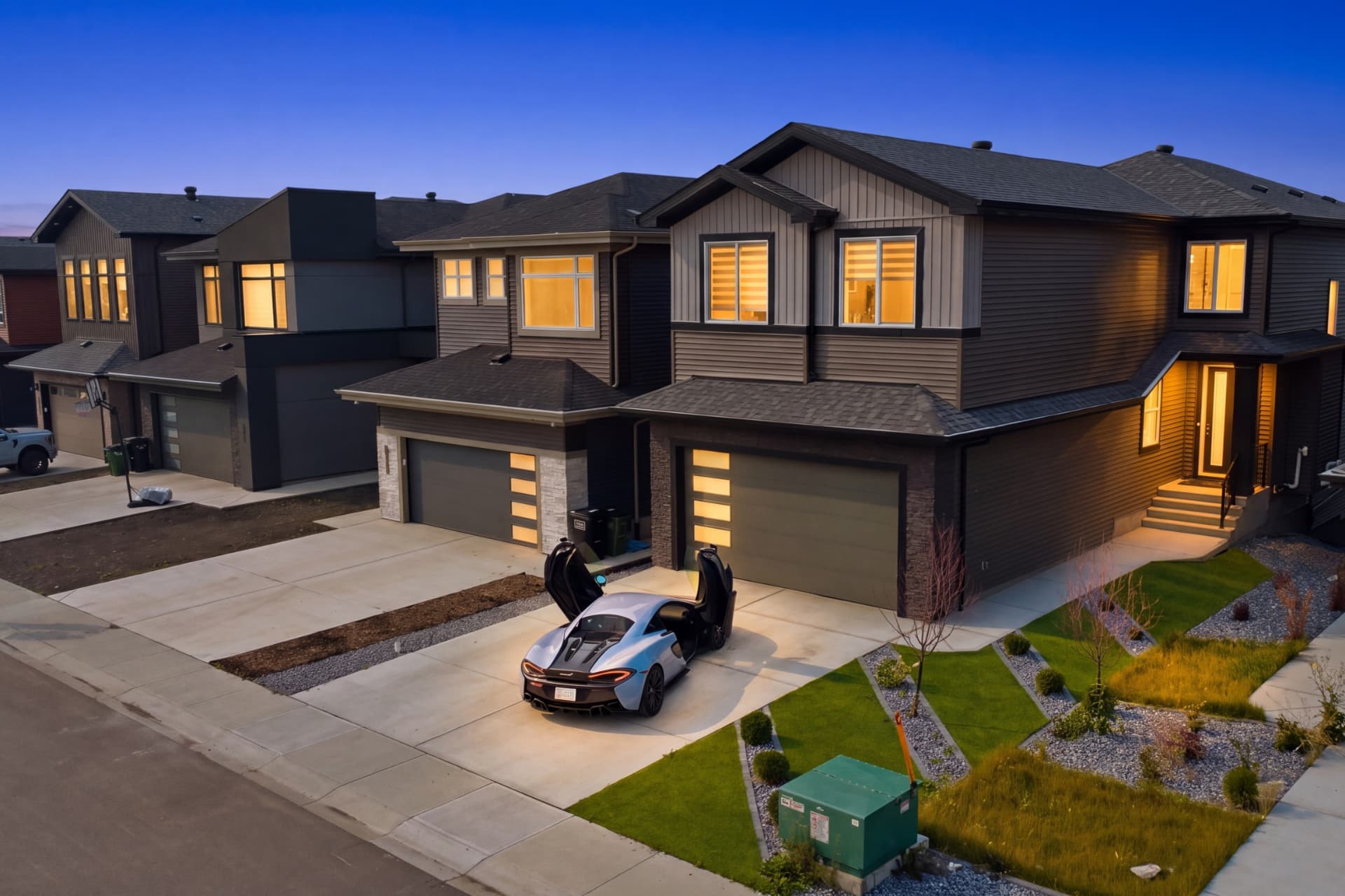 Twilight exterior photograph of a modern two-storey home